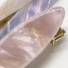 Colorful shell-patterned hair clips are fashionable and simple women's headwear accessories Application Scenario